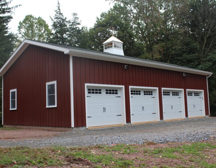 four car red metal custom detached garage