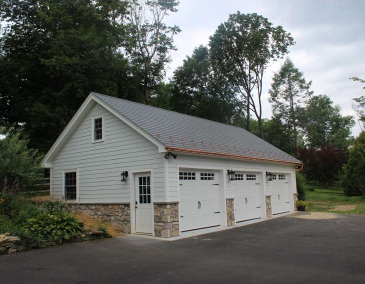 white custom three car garage