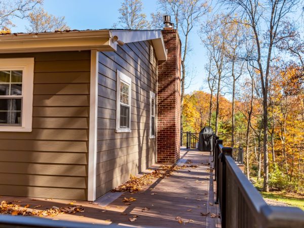 deck and vinyl railing on 2nd story of custom home