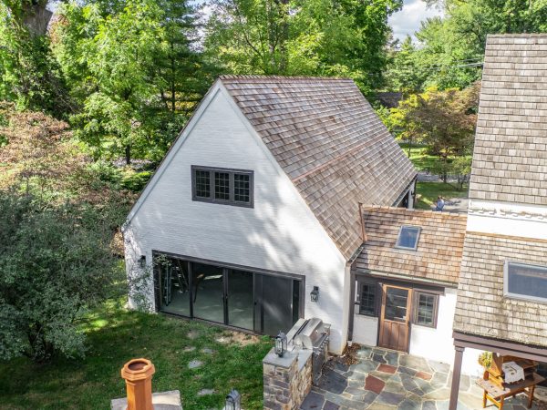 white detached two story garage
