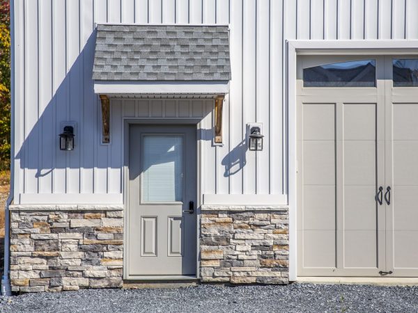 metal and stone siding on amish built garage