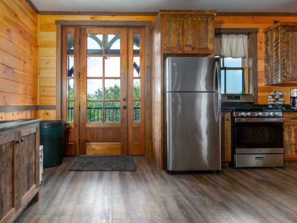 barn interior kitchen door and refrigerator