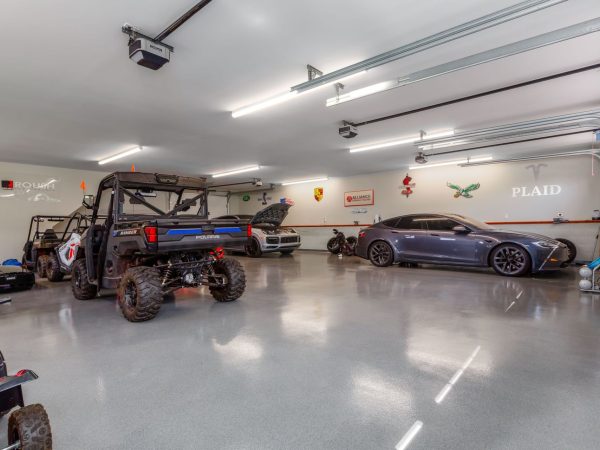 three car garage interior with cars
